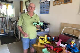 Dennis with toys in his workshop.JPEG Dennis with toys in his workshop.JPEG