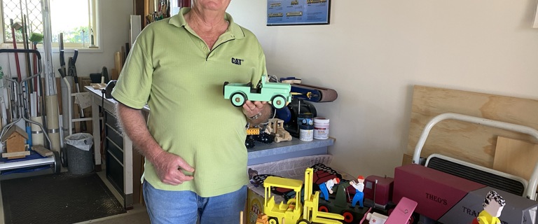 Dennis with toys in his workshop.JPEG Dennis with toys in his workshop.JPEG