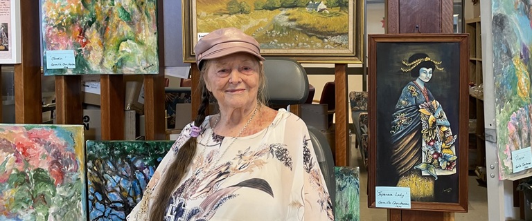 Carmille and her paintings.jpg Carmille and her paintings.jpg