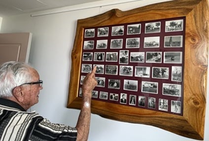 Frank looking through his photos from the early days of Caboolture_.jpg Frank looking through his photos from the early days of Caboolture_.jpg