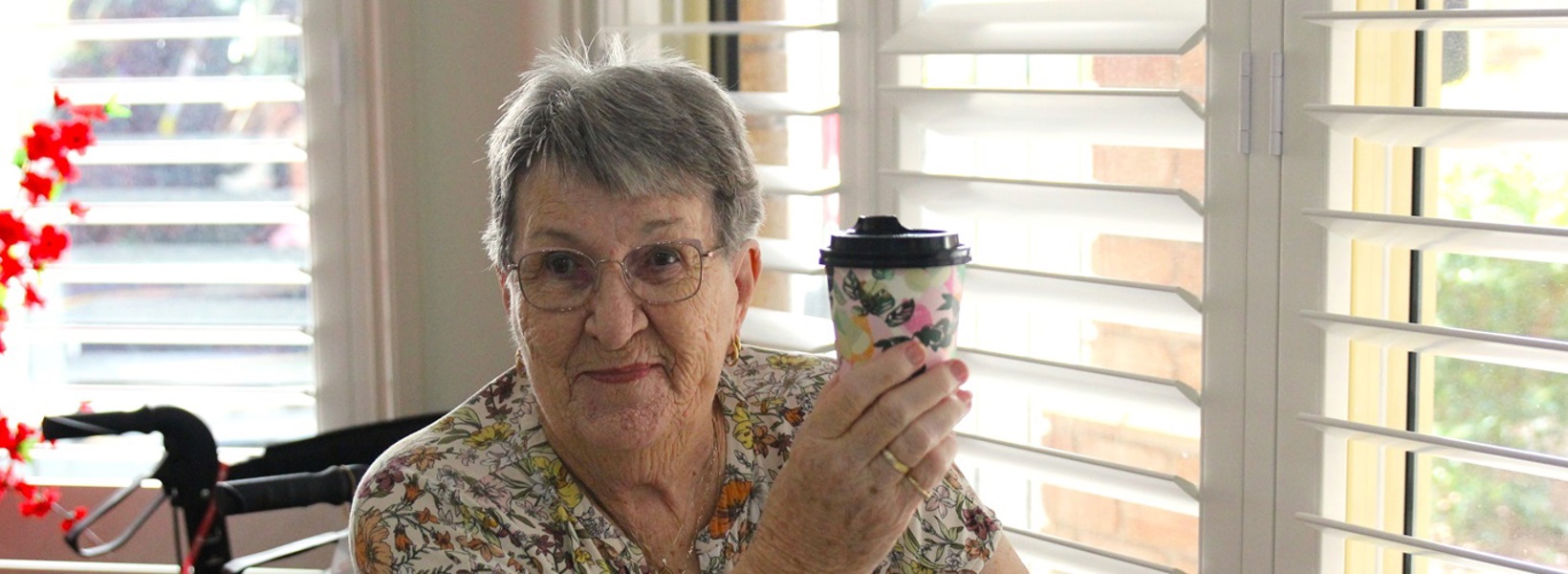 Roma enjoying her coffee.jpg Roma enjoying her coffee.jpg