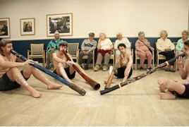 Students playing didgeridoo for residents_.jpg Students playing didgeridoo for residents_.jpg