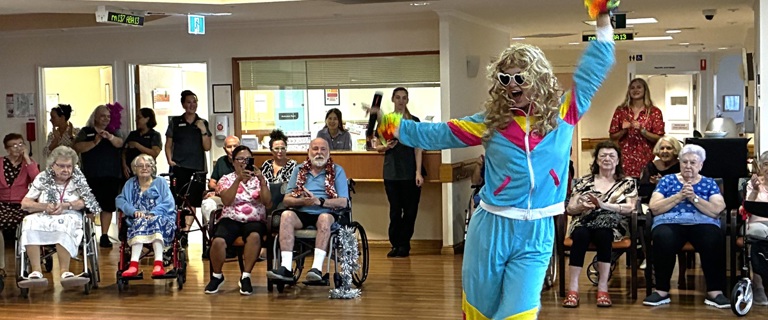 Team members performing for residents.jpg Team members performing for residents.jpg